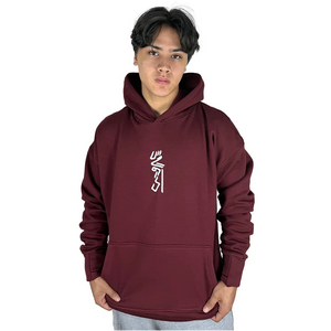 Person wearing a maroon hoodie with a logo on a white background
